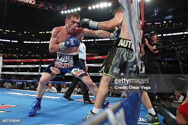 Canelo Alvarez, left, fights Liam Smith, right, during the WBO Junior Middleweight World fight at AT&T Stadium on September 17, 2016 in Arlington,...