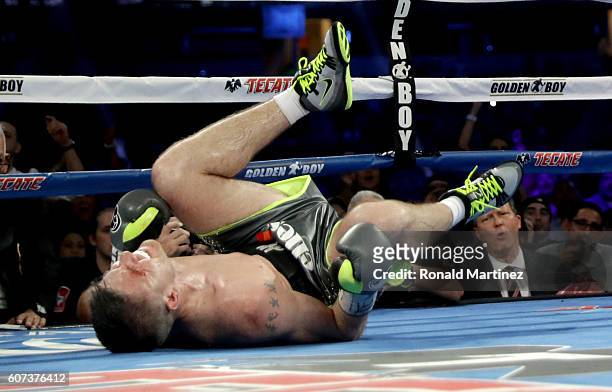 Liam Smith grimaces after being knocked down by Canelo Alvarez during the WBO Junior Middleweight World fight at AT&T Stadium on September 17, 2016...