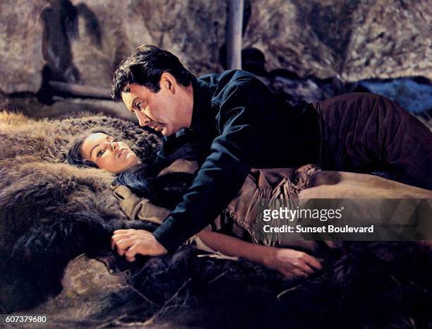 American actors Debra Paget and Robert Taylor on the set of The Last Hunt , based on the novel by Milton Lott and directed by Richard Brooks.