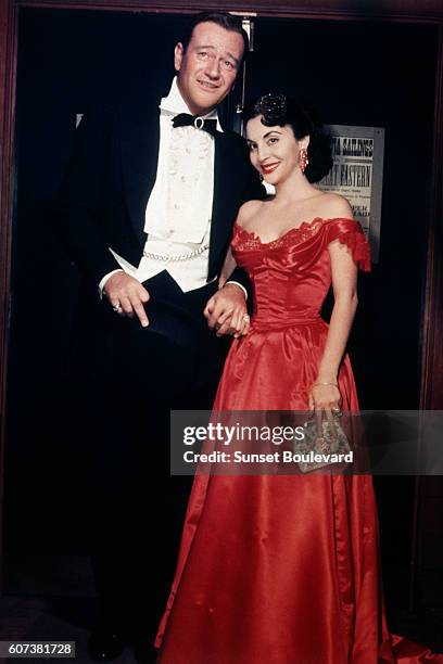 American actor John Wayne and his third wife Pilar Palette Wayne.