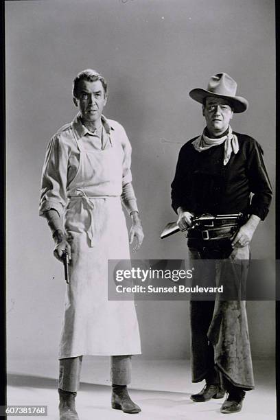 American actors James Stewart and John Wayne on the set of The Man Who Shot Liberty Valance, directed by John Ford.