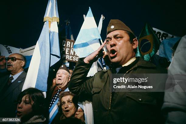 Argentine military reservists singing the national anthem during the Falklands war, which started on Friday, 2 April 1982, with the Argentine...