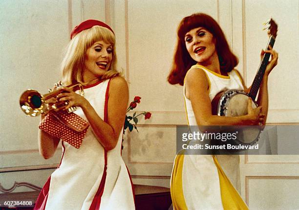 French actresses and sisters Catherine Deneuve and Françoise Dorleac on the set of Les demoiselles de Rochefort, written and directed by Jacques Demy.