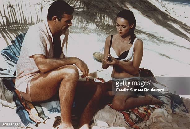 French actress Claudine Auger and Scottish actor Sean Connery star in director Terence Young's 1965 James Bond movie Thunderball, known in French as...