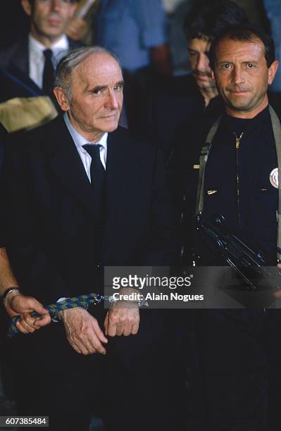 Klaus Barbie, who was the SS officer in charge of the Gestapo in Lyon, leaves the Lyon Law Courts where he has just been tried for his crimes against...