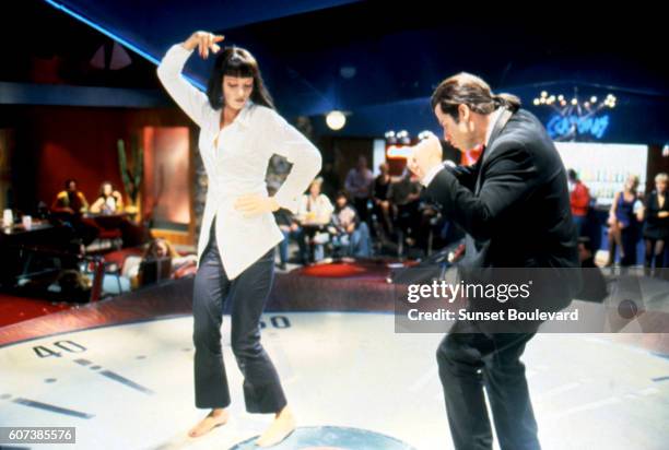 American actors Uma Thurman and John Travolta dancing during a scene in the film 'Pulp Fiction', 1994.