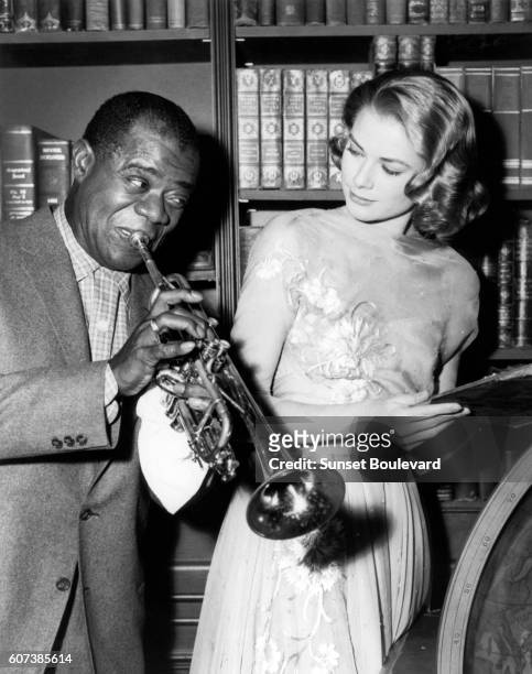 Shot from the film 'High Society' by Charles Walters. Louis Armstrong and Grace Kelly.