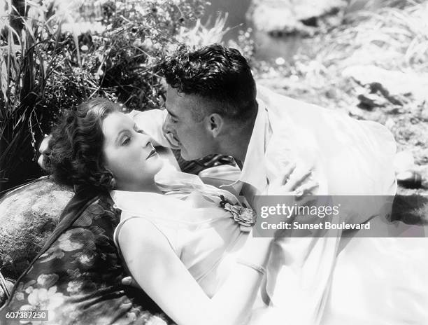 Swedish actress Greta Garbo and American John Gilbert on the set of Love, directed by Edmund Goulding.