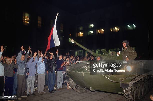 Civilians and military personnel hold a demonstration outside the Kremlin where tanks have formed a roadblock during a 1991 coup attempt. The State...