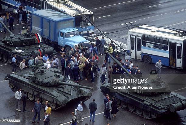 Tanks and city buses form a roadblock outside the Russian White House during a 1991 coup attempt. The State Committee for the State of Emergency, a...