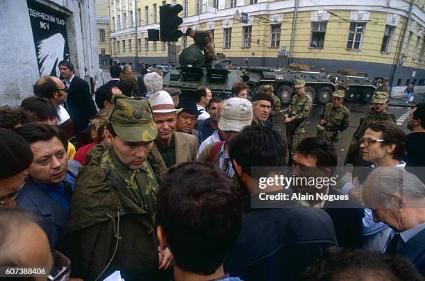 Civilians and military personnel hold a demonstration outside the Kremlin where tanks have formed a roadblock during a 1991 coup attempt. The State...