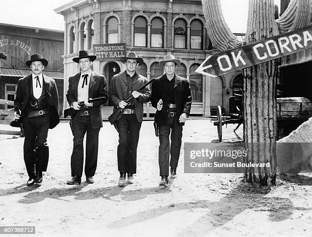 American actors Kirk Douglas, Burt Lancaster, John Hudson and Kelly Deforest on the set of Gunfight at the O.K. Corral, directed by John Sturges.