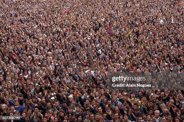 Crowds cheer as Russian President Boris Yeltsin speaks at the balcony of the Russian White House after a 1991 coup attempt is thwarted. The State...