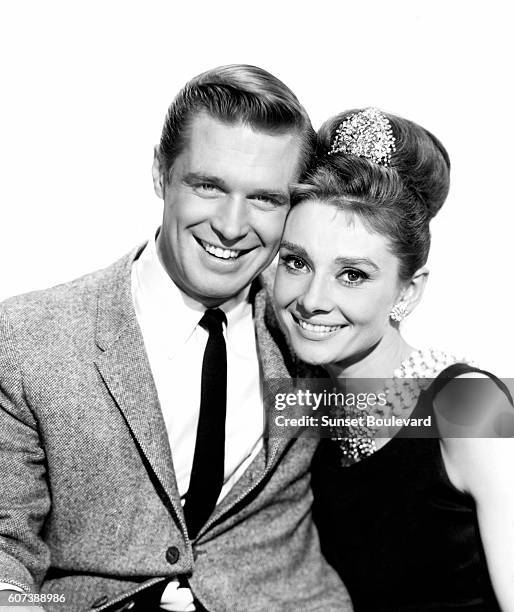 American George Peppard and British actress Audrey Hepburn on the set of Breakfast at Tiffany's, based on the novel by Truman Capote and directed by...