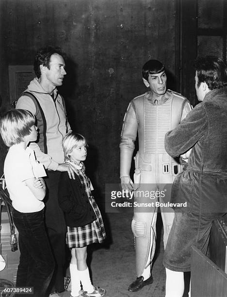 American actor, director and producer Clint Eastwood with children Kyle and Alison , and actor and director Leonard Nimoy.