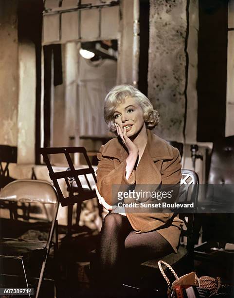 American actress Marilyn Monroe on the set of Let's Make Love, directed by George Cukor.