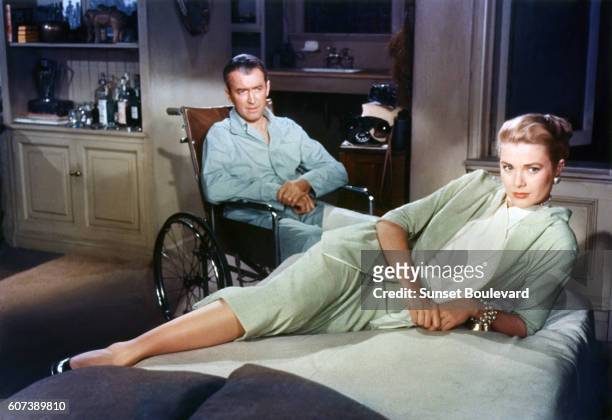 American actors James Stewart and Grace Kelly on the set of Rear Window, directed and produced by British Alfred Hitchcok.