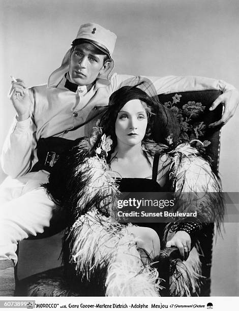 American actor Gary Cooper and German-American actress Marlene Dietrich on the set of Morocco, directed by Josef von Sternberg.