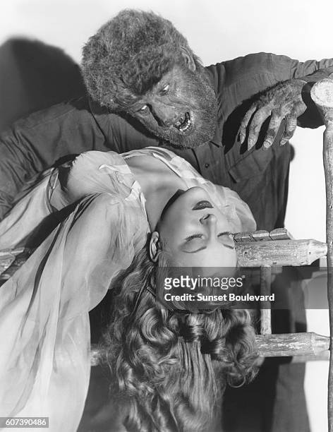 American actor Lon Chaney Jr. And British actress Evelyn Ankers on the set of The Wolf Man, directed by George Waggner.