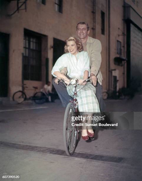 American actors Grace Kelly and James Stewart on the set of Rear Window, directed and produced by British Alfred Hitchcok.
