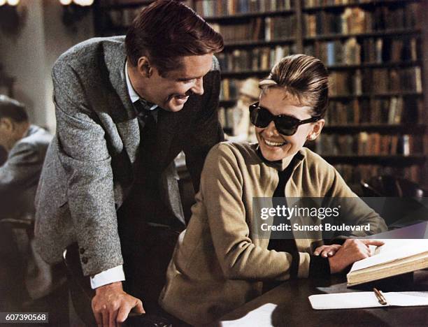 American George Peppard and British actress Audrey Hepburn on the set of Breakfast at Tiffany's, based on the novel by Truman Capote and directed by...