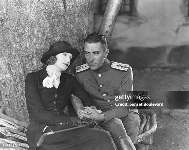 Actress Greta Garbo and actor John Gilbert on the set of "Love".