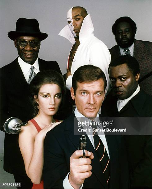 Actors Roger Moore, Yaphet Kotto, Julius W.Harris, Geoffrey Holder, Earl Jolly Brown and actress Jane Seymour, on the set of "Live And Let Die".
