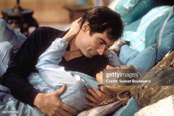 Actor Timothy Dalton and actress Maryam d'Abo on the set of "The Living Daylights".