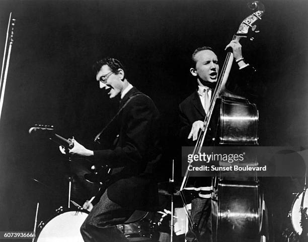 American singer and guitarist Buddy Holly and bassist Joe B.Mauldin perform during the Alan Freed Show in New York.