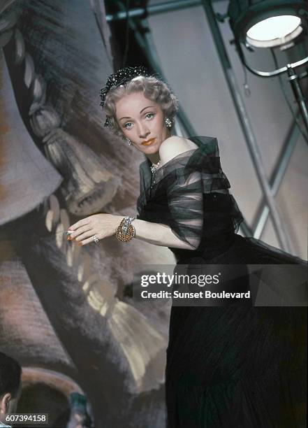 German actress Marlene Dietrich on the set of Stage Fright, directed and produced by British Alfred Hitchcock.