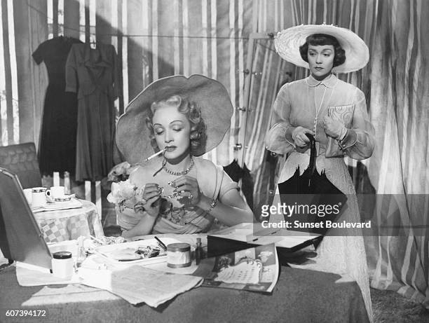 German-American actress Marlene Dietrich and American actress Jane Wyman on the set of Stage Fright, directed and produced by British Alfred...