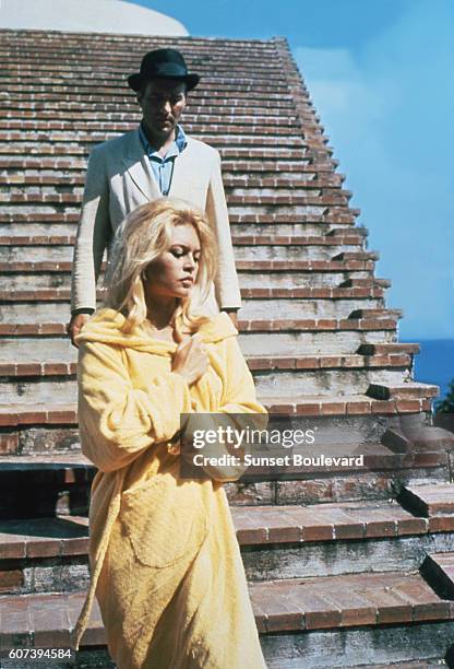 Michel Piccoli and Brigitte Bardot on the set of "Le Mepris" .