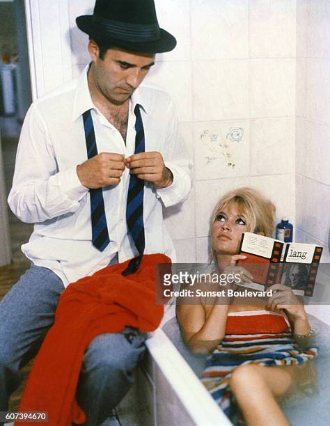Michel Piccoli and Brigitte Bardot on the set of "Le Mepris" .
