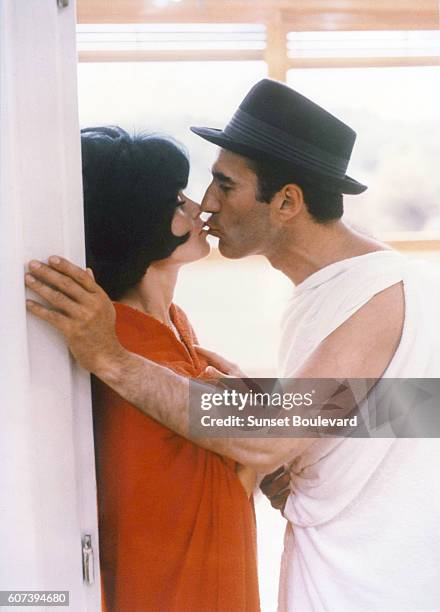 Michel Piccoli and Brigitte Bardot on the set of "Le Mepris" .