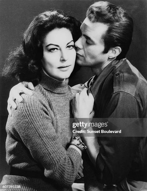 American actress Ava Gardner and British actor Dirk Bogarde on the set of The Angel Wore Red, written and directed by Nunnally Johnson.