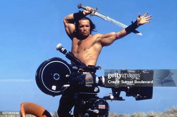 Austrian-born American actor Arnold Schwarzenegger on the set of Conan the Barbarian, directed by John Milius.