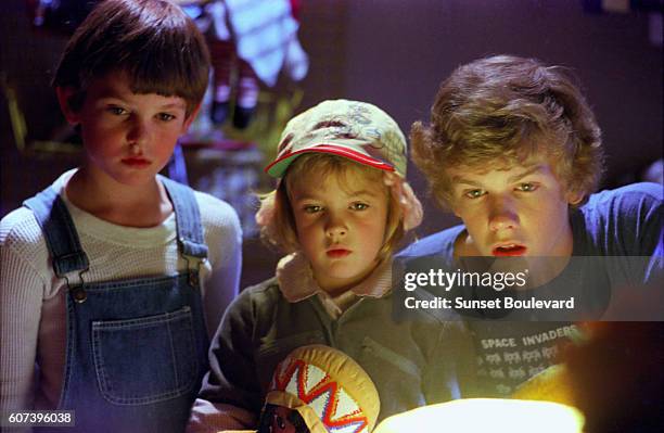 Henry Thomas, Drew Barrymore, and Robert Macnaughton on the set of "E.T.".