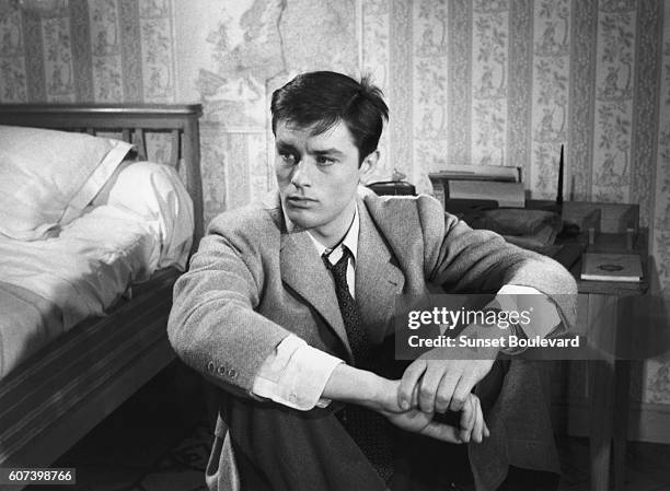 French actor Alain Delon on the set of Le Chemin des Ecoliers, directed by Michel Boisrond.