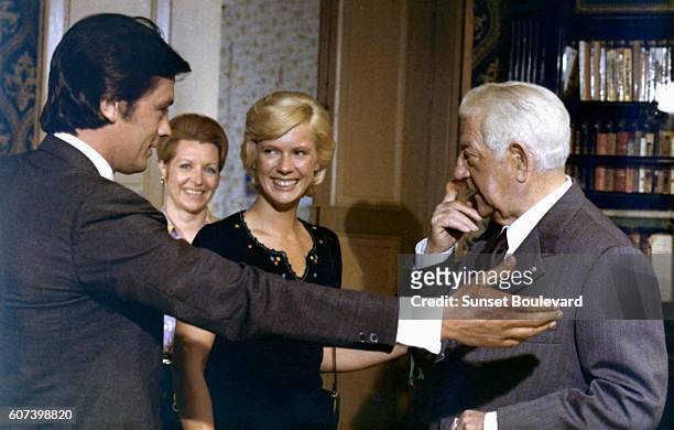 French actors Alain Delon and Jean Gabin and American actress Mimsy Farmer on the set of Deux Hommes dans la Ville , written and directed by Jose...