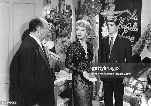 French actors Bernard Blier, Edwige Feuillere and Alain Delon on the set of Quand la femme s'en Mele, directed by Yves Allegret.