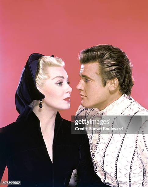 American actress Lana Turner and British actor Roger Moore on the set of Diane, directed by American David Miller.
