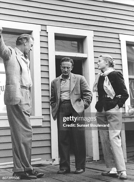 American actors Gary Cooper and Grace Kelly with Austrian-American director Fred Zinnemann on the set of his movie High Noon.