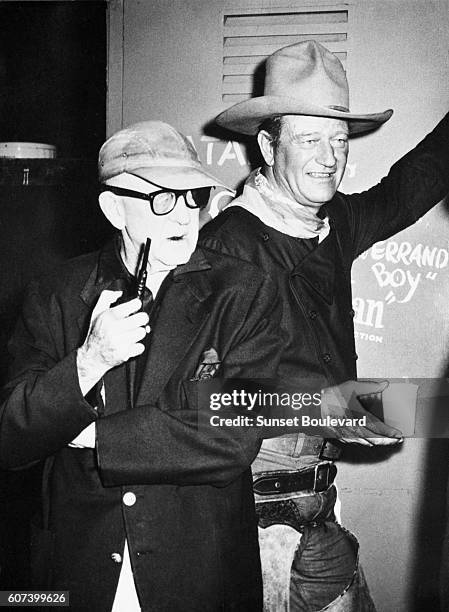 American actor John Wayne with director and producer John Ford on the set of his movie The Man Who Shot Liberty Valance.