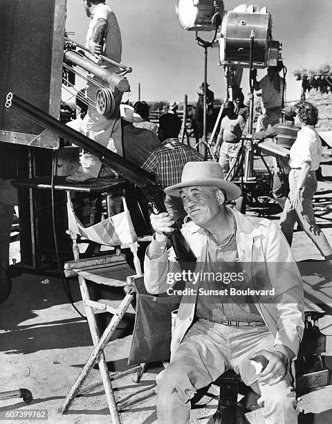 American director John Huston on the set of his movie The Unforgiven.