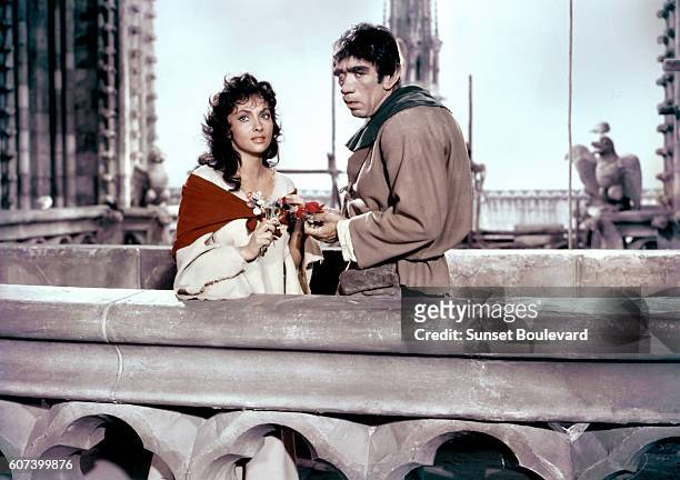 Italian actress Gina Lollobrigida is Esmeralda, and Mexican-born American actor Anthony Quinn is Quasimodo in The Hunchback of Notre Dame, by French...