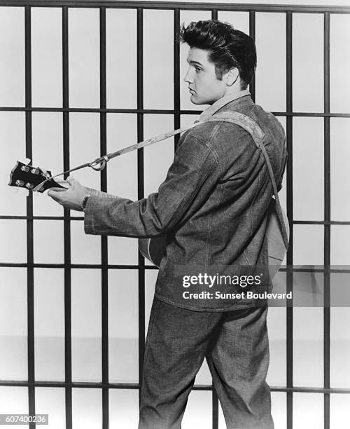 American singer and actor Elvis Presley on the set of Jailhouse Rock, directed by Richard Thorpe.
