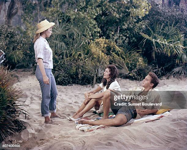 American actress Joanna Moore, Canadian actress Anne Helm, and singer and actor Elvis Presley in Follow That Dream directed by Gordon Douglas.