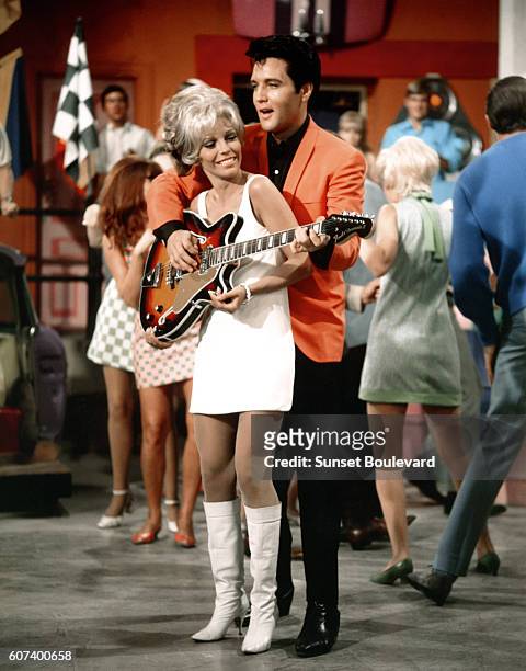American singers and actors Nancy Sinatra and Elvis Presley on the set of Speedway, directed by Norman Taurog.