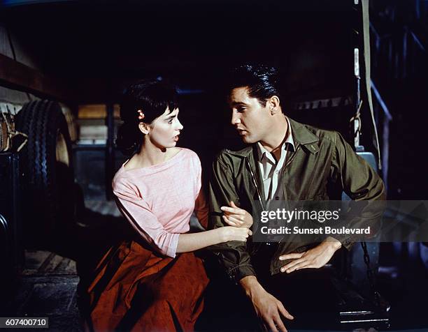 American actors Millie Perkins and Elvis Presley on the set of Wild in the Country, directed by Philip Dunne.