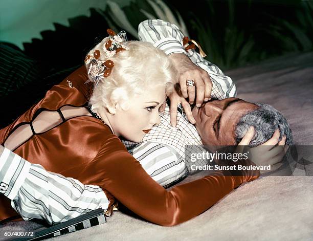 American actors Kim Novak and Jeff Chandler on the set of Jeanne Eagels directed and produced by George Sidney.